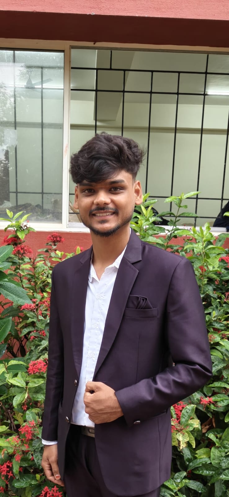 Aryan Nagori wearing a dark blazer